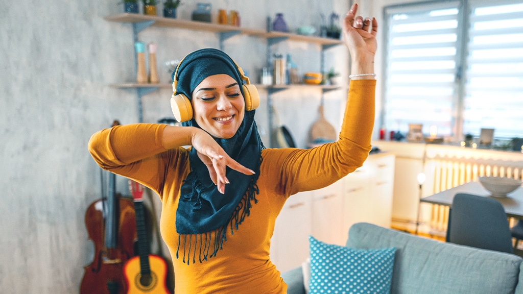 Woman dancing with headphones on her head