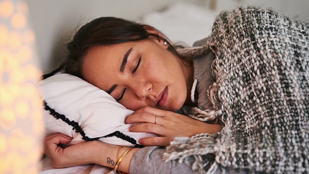Cropped shot of a woman sleeping peacefully in her bed
